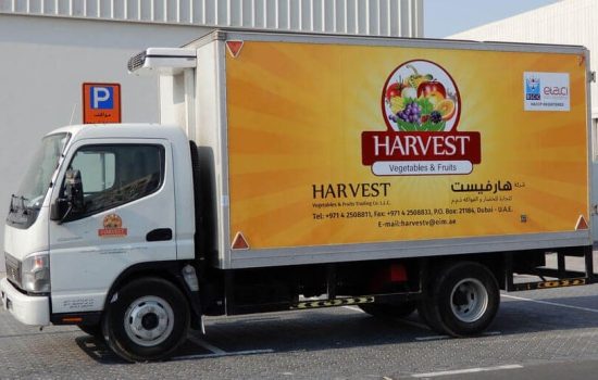 partial truck branding work on delivery fleet